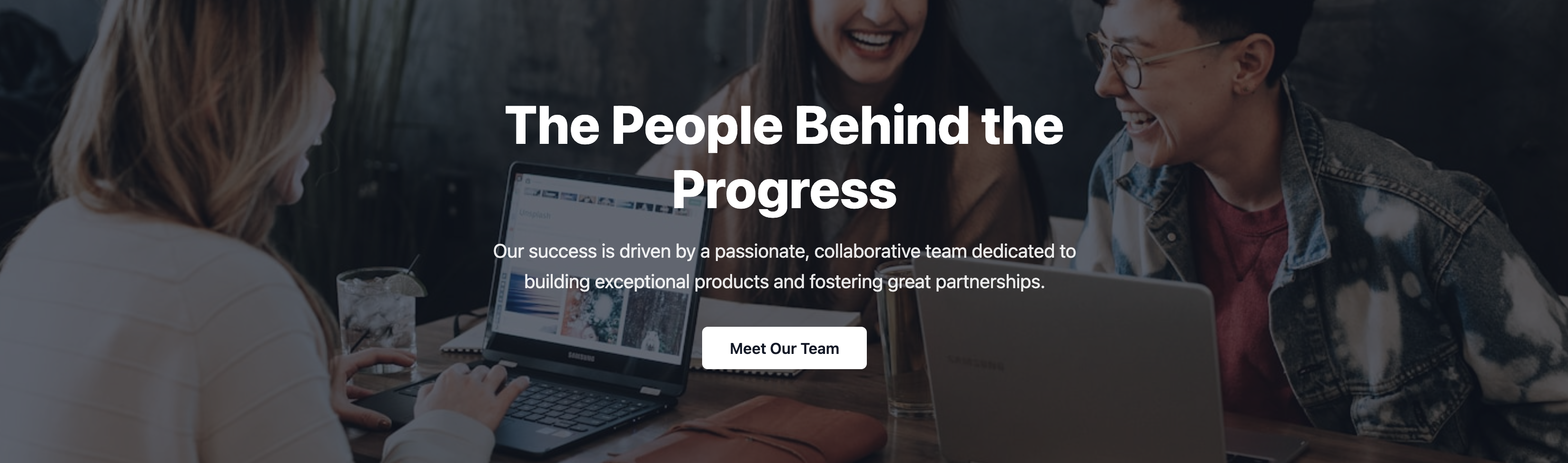 Screenshot of a hero section featuring a photo of the company team.