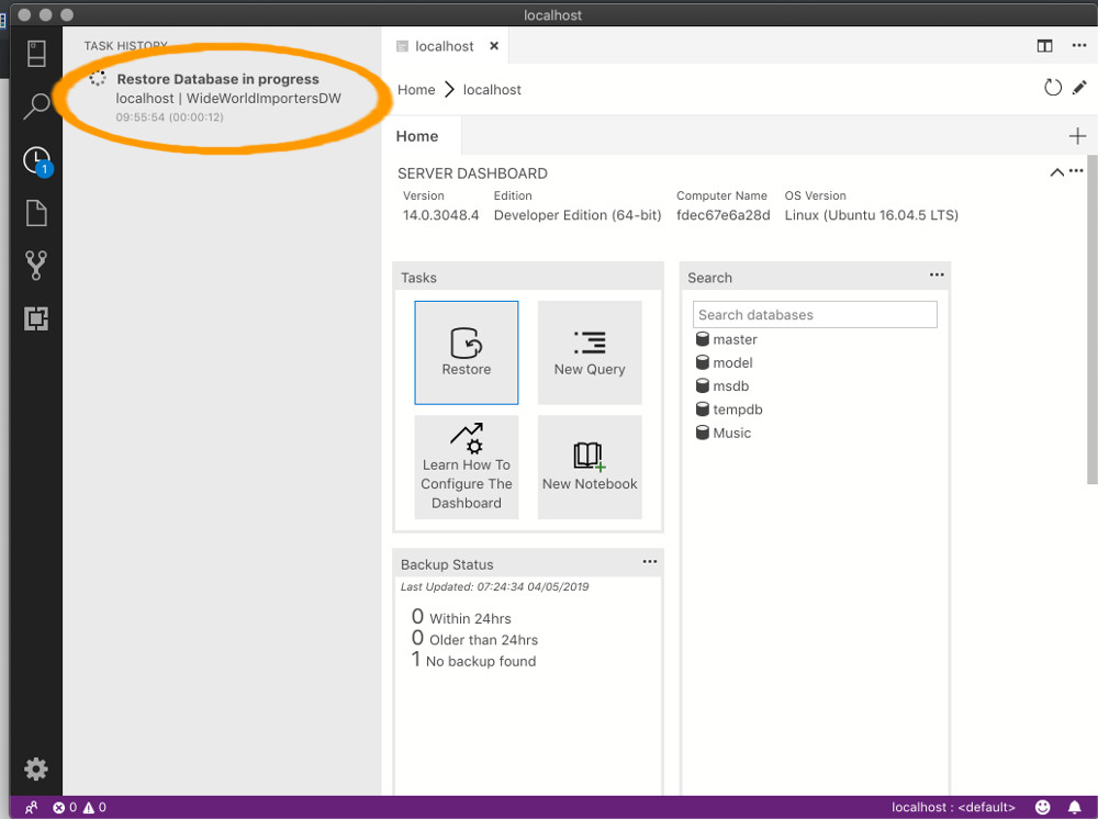 Screenshot of Azure Data Studio with the Task History bar displaying a message that the restore is complete.